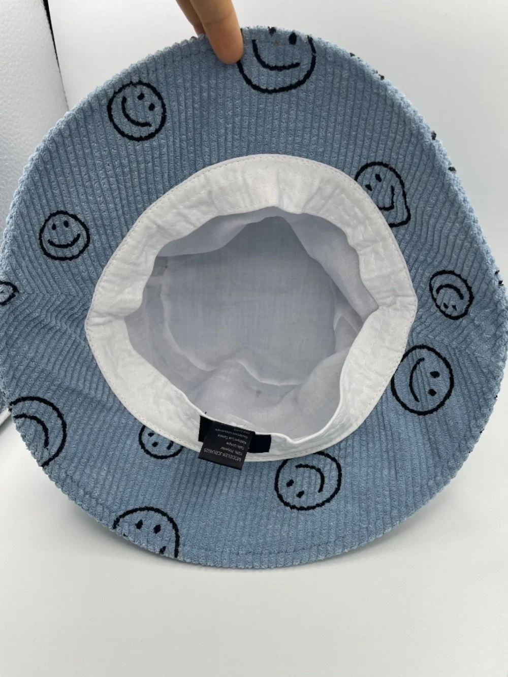 David and Young blue corduroy smiley faces buckle hat